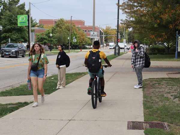 Student riding a bike.