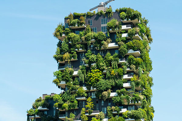 Image of building with a green garden on balconies