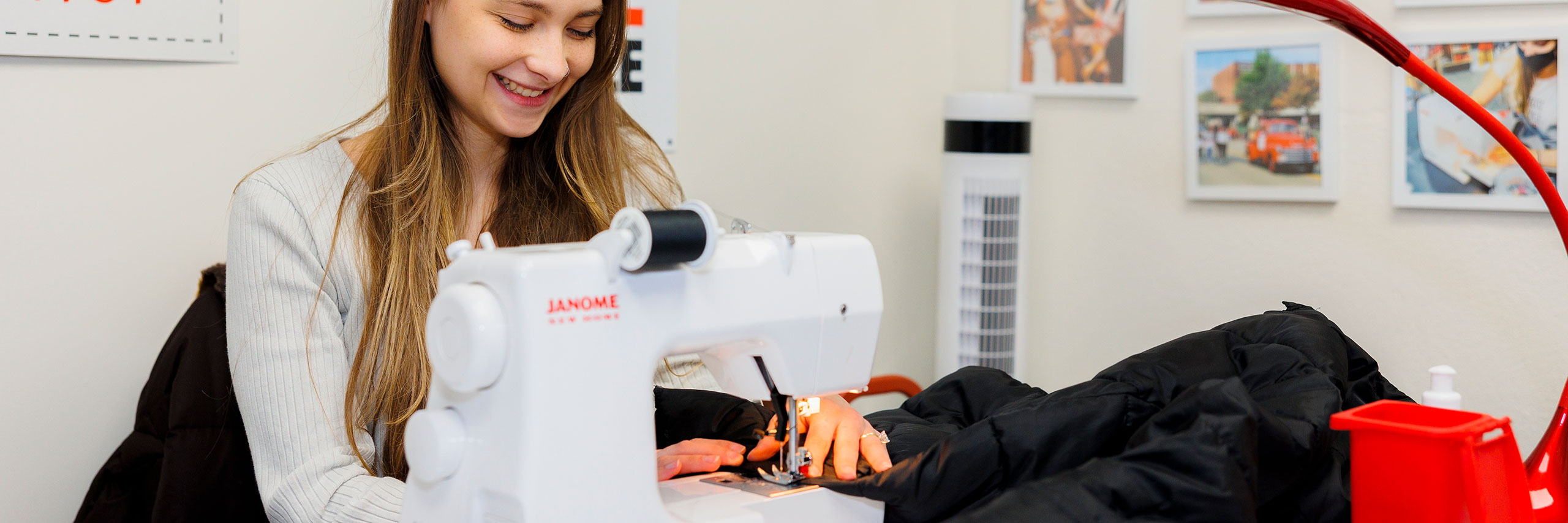 A student sews clothes.