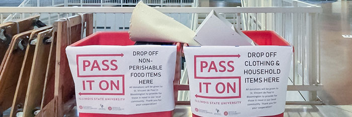 Two 'Pass it On' drop off bins.